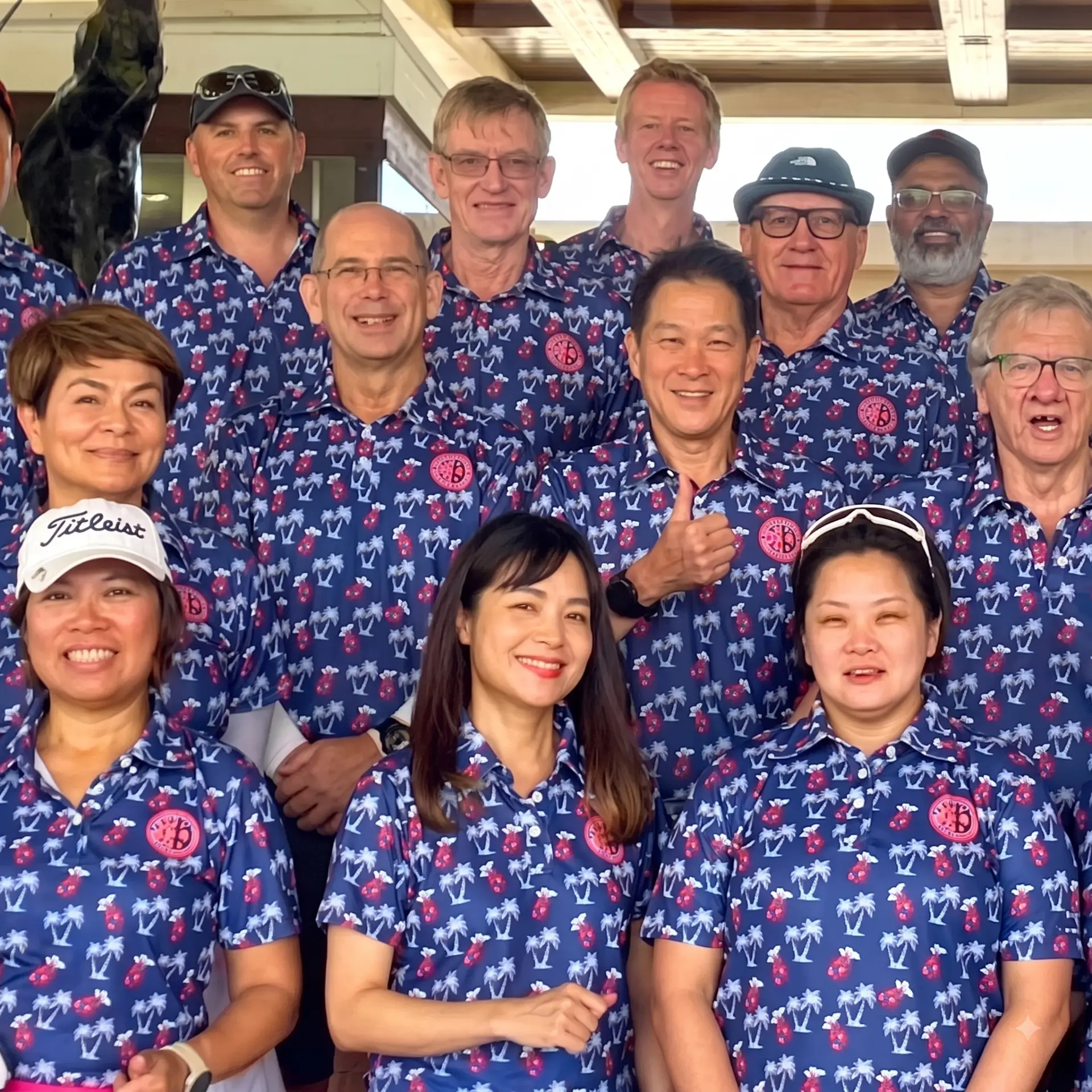 The British Club Singapore golf section group photo in navy palm-print tour polos