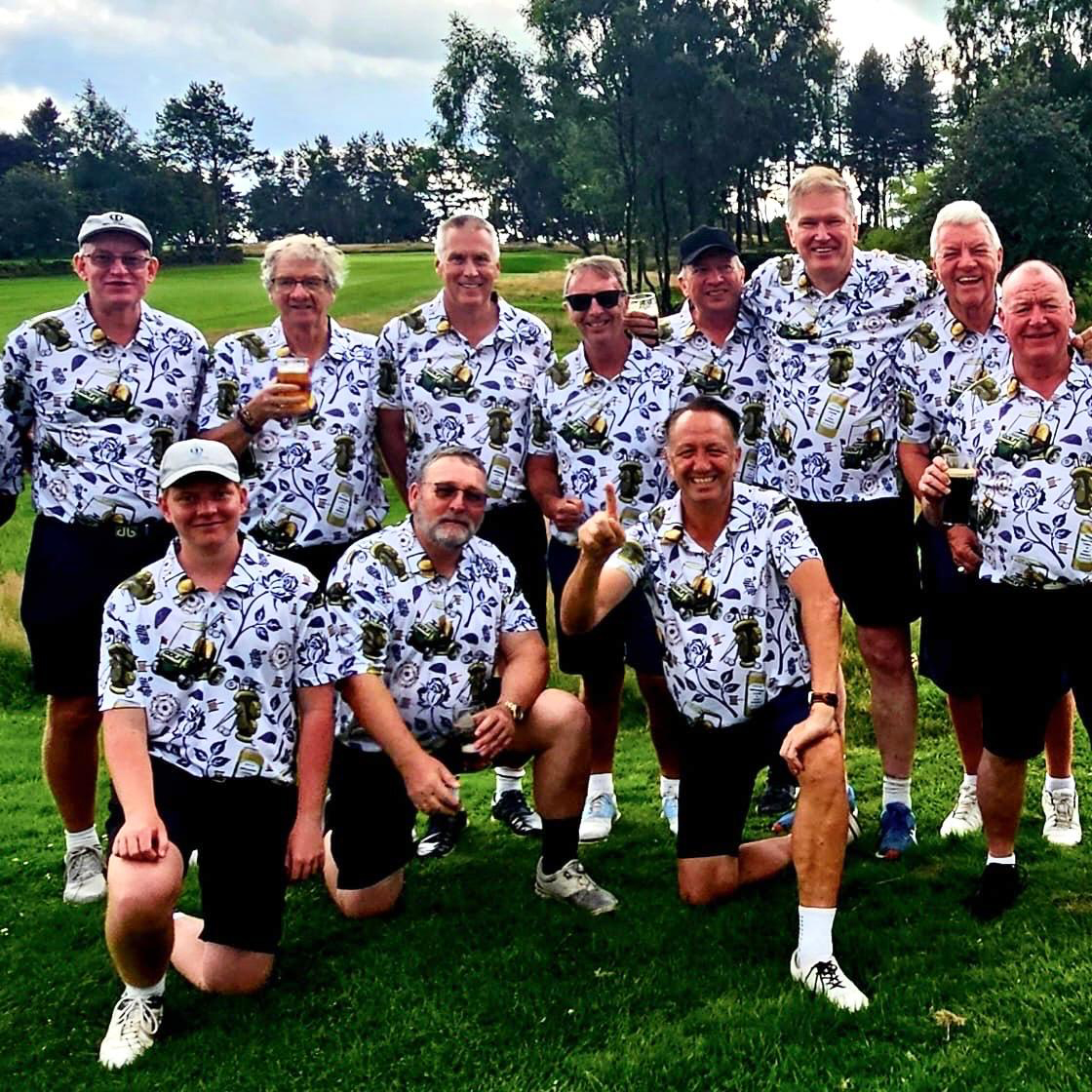 Yorkshire golf society squad posing on the fairway in matching white rose print tour polos