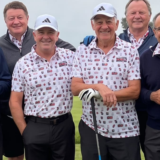MUGS golf society members on the tee in matching white and red Georgia tour polos